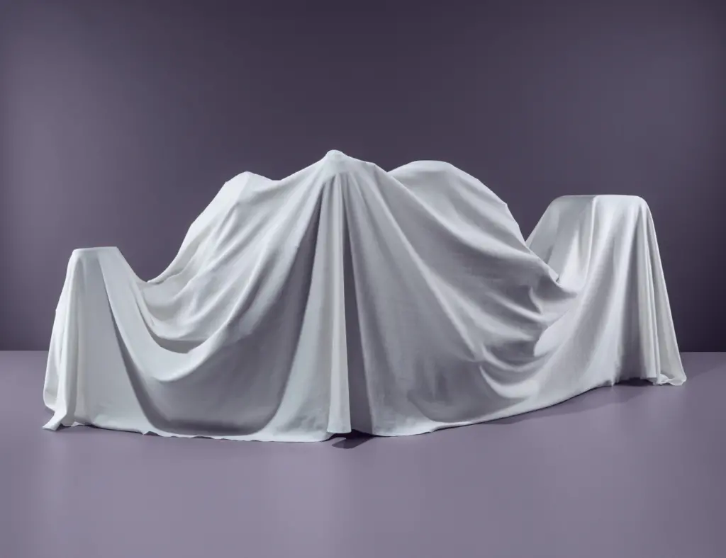 porsche 911 a white cloth covered table