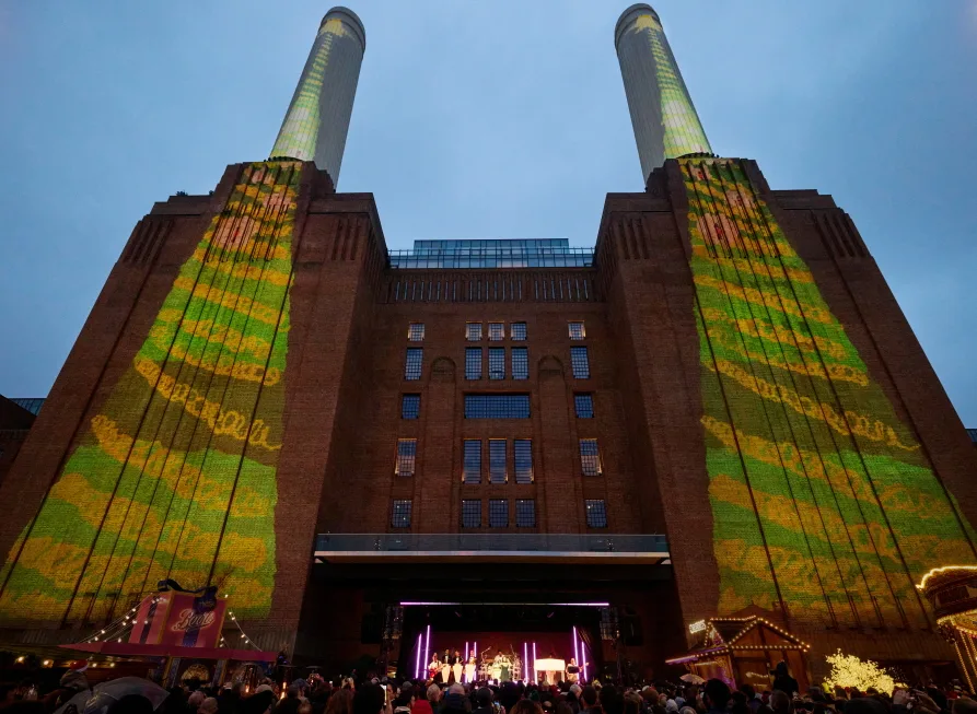 Apple’s U.K. headquarters welcome His Majesty King Charles III, December 12 9 Apple Battersea community impact holiday projection https://mobilityground.com/wp-content/uploads/2024/12/Apple-Battersea-community-impact-Tim-Cook-and-King-Charles-III.webp